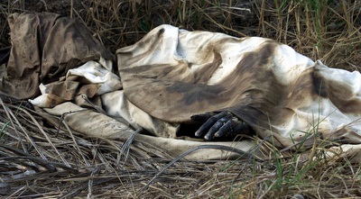 גופת אזרח חוף השנהב בעת מלחמת האזרחים (רויטרס)
