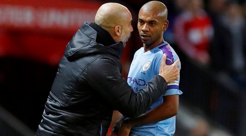 Pep Guardiola passes instructions to Fernandinho (Reuters)